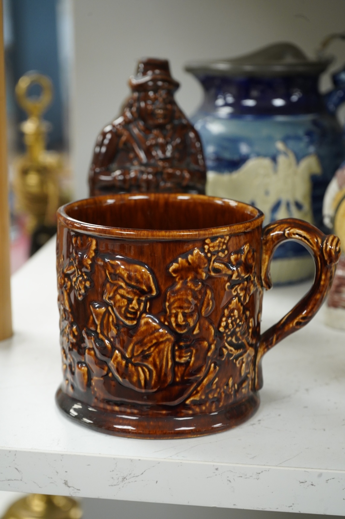 A group of various Victorian Staffordshire pottery models of cottages and various figure moulded vessels together with an Italian maiolica ewer, tallest 25cm